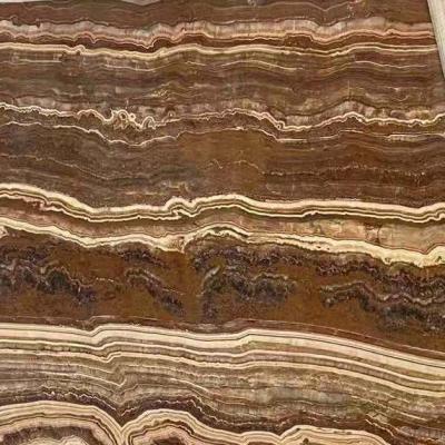 China Natural Kashmir Onyx Brown Onyx Stone Mateiral Home Decor Coffee Line For Design Slabs Tiles Wall Floor for sale