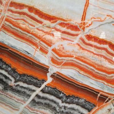 China Modern Rainbow Red Onyx Starlica Onyx Interior Wall and Floor Applications Countertop Mosaic Fountains for sale