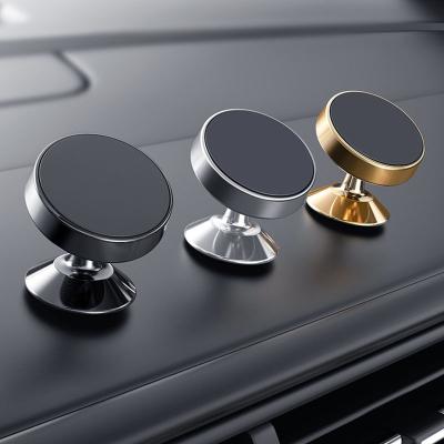 China Car Mobile Phone Navigation Bracket Car Air Vent 360 Degree Rotating Magnet Bracket Dashboard Sticker Magnetic Bracket for sale