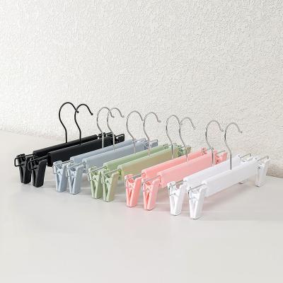 China Eco-Friendly Clothes Hanger High Quality Pvc Trouser Hangers Adult Plastic Hangers With Clamps Home Closet Pants Hangers for sale