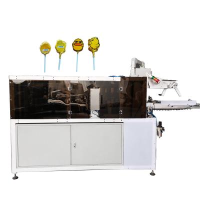 China Latest Design Paketleme Makinesi Automatic Lollipop Stick Chocolate Wrapping Colorful Lollipop Candy Heart Foil Packaging Machine for sale