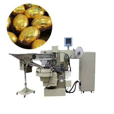 China Automatic Mesin Pembungkus Bola Coklat Chocolate Ball Wrapper Food Chocolate Egg Wrapping Machine Chocolate Egg Wrapper Machi for sale