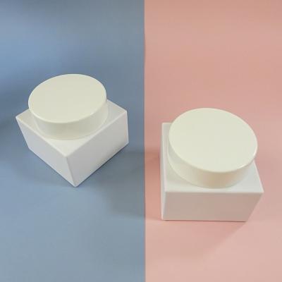 China Cosmetic Plastic Container Square Cap Empty Base Round Cream Jar Face Cream Container for sale