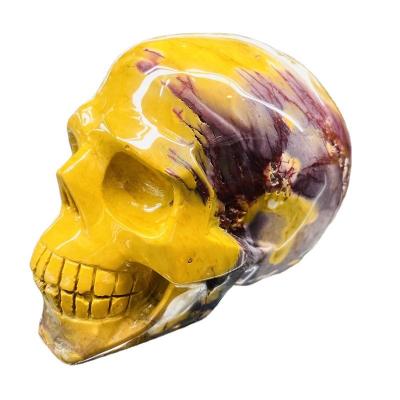 China China Hot Selling Natural Hand Carved Egg Yellow Stone Crystal Skulls For Healing Decoration for sale