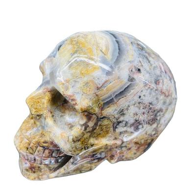 China China wholesale natural crystal folk art crafts healing mad agate skulls for decoration for sale