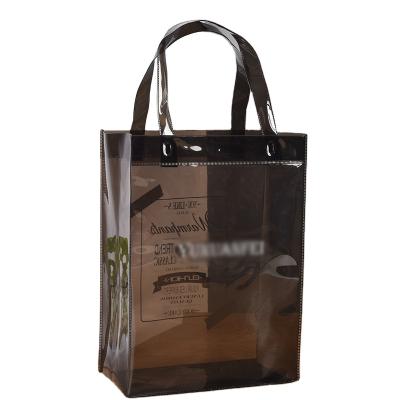 China Hot Sale Eco-friendly PVC Plastic Clear Tote Hand Bag Ladies Black Transparent Shopping Bag For Women for sale