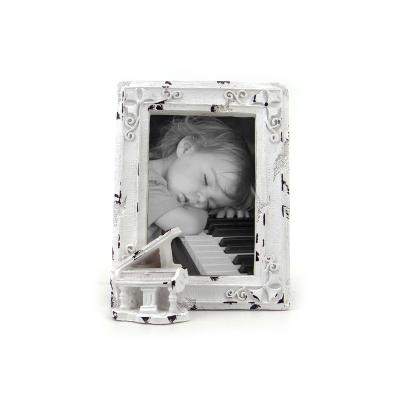 China Art Deco Creative White Piano Resin Picture Frame Ornament Children's Photo Frame Decoration Home Ornament for sale