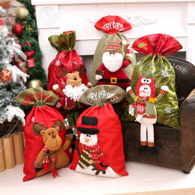 China Cheap Santa Claus Stocked Pile Cloth China Made Christmas Santa Sacks Drawstring Printed Bags OEM Factory Wholesale for sale