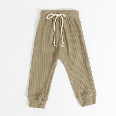 China Fashionable boutique breathable spring design knitted cotton color kids boy long ribbed pants with drawstrings baby pants for sale