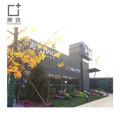 China Canton office collapsible container 20ft price flat-pack sandwich panel garden parking lot prefab house cafe for sale