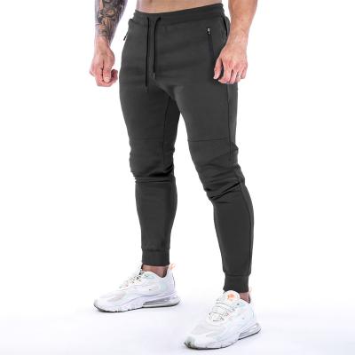 China Men's Muscle Viable Back Towel Fitness Cotton Feet Breathable Hanging Pants Gym Running Sweatpants Slim Men's Sports Exercise Pants for sale