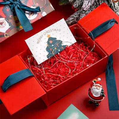 China Recycled Materials OEM Book Style Christmas Perfume Paper Folio Open Gift Box With Ribbon For Christmas Packaging for sale