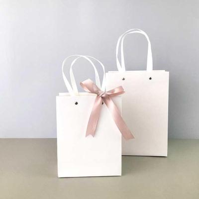 China Recycled Materials Custom Printed Your Own Logo Wholesale Brown White Gift Craft Kraft Paper Shopping Paper Packaging Bag With Handles Ribbon for sale