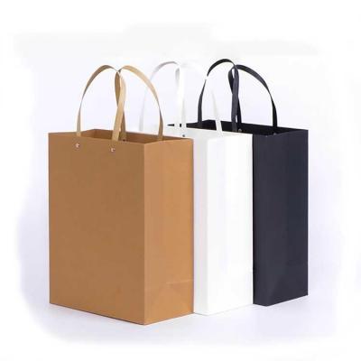 China Recycled Materials Twisted Handle White And Brown Shopping Carrier Kraft Paper Bag With Logo Printed for sale