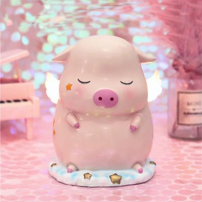 China Decoration Time Amazon Birthday Gift Decor Accessories Slow Home Pig With Wings Cartoons Piggy Bank Coin Bank Light Ornaments for sale