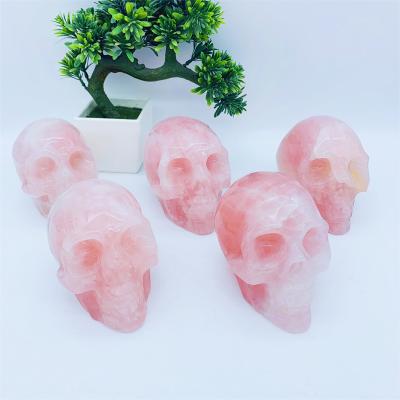 China Wholesale Europe High Quality Hand Carved Natural Rose Quartz Crystal Skulls For Souvenir for sale