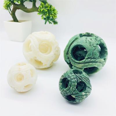 China Europe Crystal Gemstone Xiuyan Jade Sphere Hollow Carving White Green High Quality Wholesale for sale