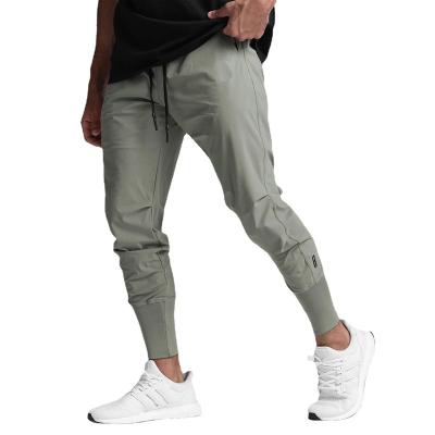 China Waterproof Jogging Outdoor Casual Jogging Pants Men Work Cargo Breeches Mens Trousers Pants for sale