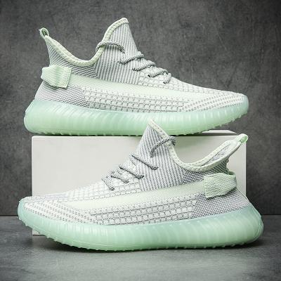 China Fashion trend new style sneakers men's yeezy breathable sports shoes 350 fly running shoes women's knitting tennis shoes for sale