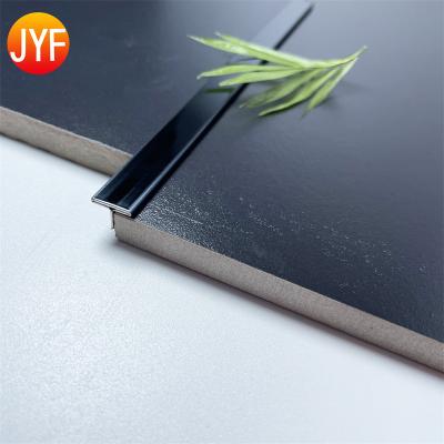 China Modern H648 304 Matt Stainless Steel Black Hollow T Shaped Profile Tile Junction Panel Floor Border Trim for sale