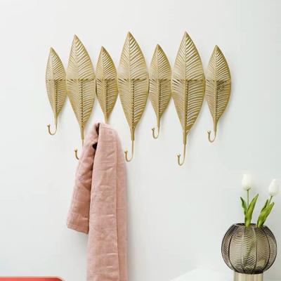 China Minimalist Metal Leaf Set Hangs Living Room Coat Hook Wall Decoration Key Gold Hook for sale