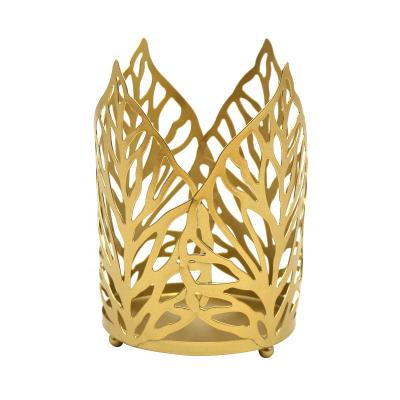 China Modern Top Art Selling Iron Nordic Creative Hollow Home Decoration Gold Leaf Candle Holder for sale