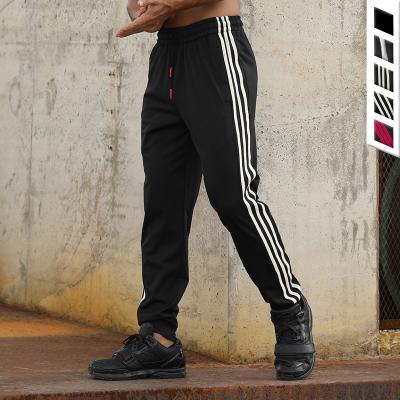 China QUICK DRY Quick Dry Men's Gym Jogger Pants Workout Running Striped Sweatpants With Zipper Pockets for sale