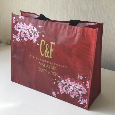 China New Desgin Handled Cross Stitching Laminated Non Woven Bag PP Nonwoven Shopping Bag for sale