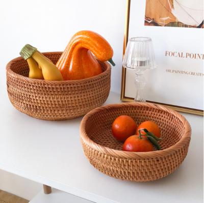 China High Quality Handmade Natural Rattan Woven Fruit Basket Stored Round Fruit Food Tray Wicker Snack Storage Box for sale