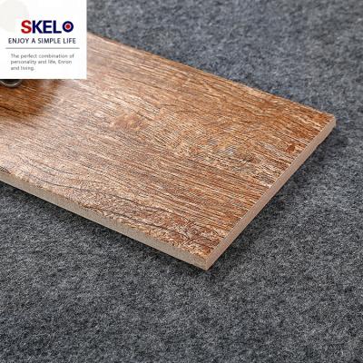 China Rustic Tiles 600*150mm Living Room Flooring Wood Plank Look Ceramic Tile Homogeneous Anti-Slip Brown Wood Effect Floor Tiles for sale