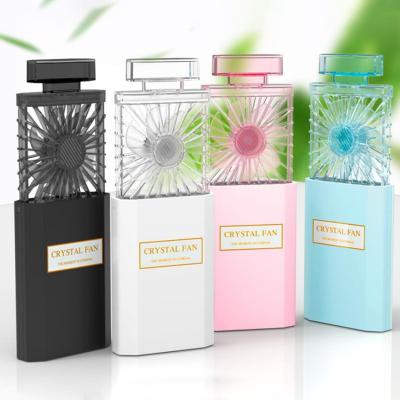 China 2021 white car perfume bottle fan 1200mah lithium battery non-electric fans pocket mini usb fan for girls for sale