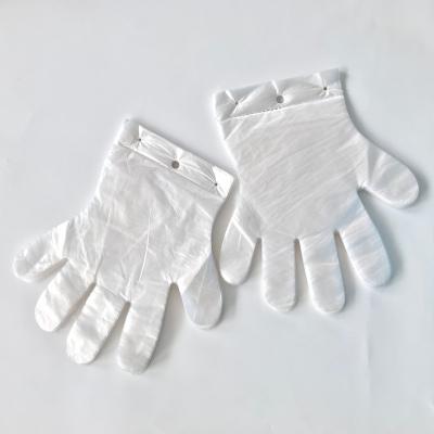 China Anti-slip anti-slip with 0.7g package transparent HDPE glove eyelet cleaning disposable glove eco food PE plastic gloves with hole for sale