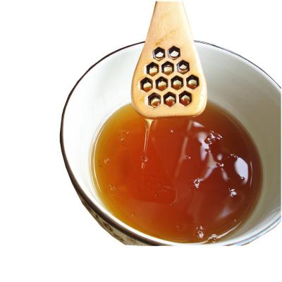 China Long viable wooden handle wholesale wooden honey stick convenient use of honey spoon unique process health and environmental protection material for sale