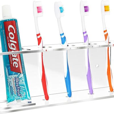 China Luxury Modern Wall Mounted Clear Acrylic Toothbrush and Toothpaste Rack Holder / Bathroom Storage Shelf for sale