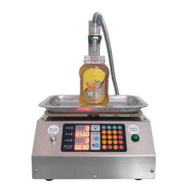 China Small canned automatic filling machine quantitative food honey tahini oil consumption edible oil weighing liquid filling machine for sale