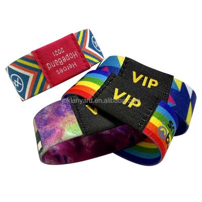 China Cheap Custom Fabric Woven Elastic Wristband Sublimation Fabric Logo Full Color Print Party Basketball Sports Festival Polyester Wristband for sale