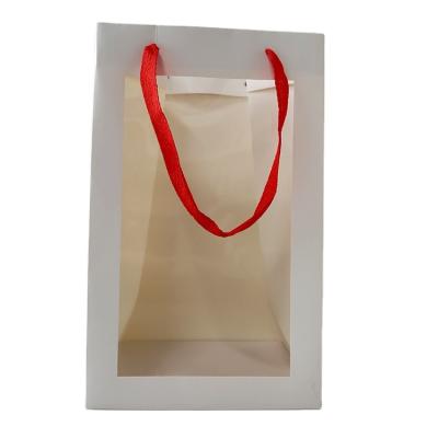 China Recyclable Custom White Paper Gift Bags With Clear Window Ivory Paper Bags For Flower for sale