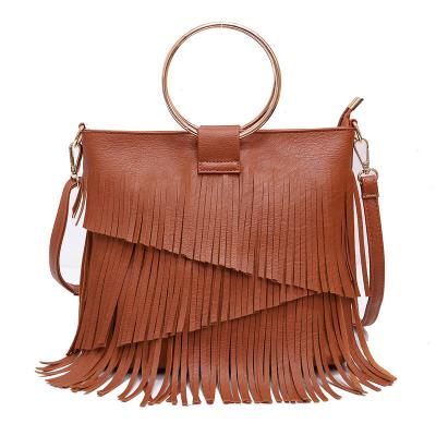 China Fashion Personalized PU Leather Luxury Tassel Wrist Irregular Layered Handbag For Woman for sale