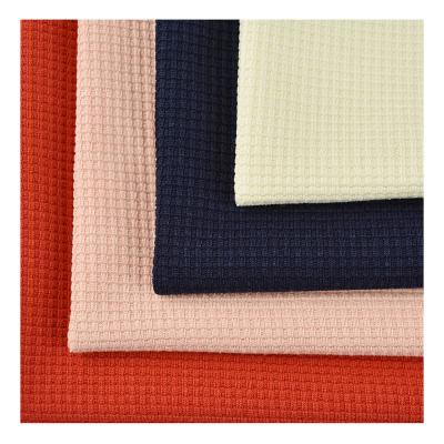 China Textile manufacturers 40S Anti pilling solid colors 100% polyester cotton like waffle fabric for home wear for sale