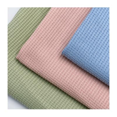 China Anti-Pilling Colorful Polyester Waffle Fabric Solid Plain Knitted For T-Shirt for sale