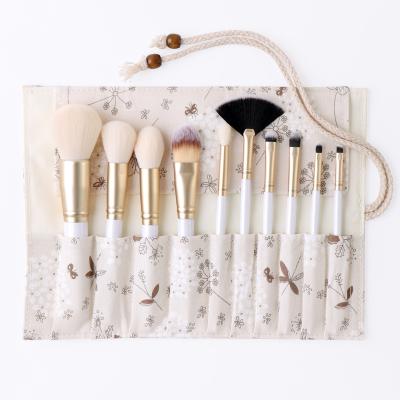 China Angular Blush 10PCS China Seller Price Custom Logo Wooden White Luxury Makeup Brush With Flora Package Bag for sale