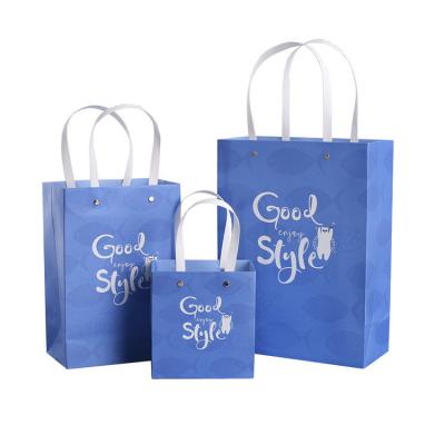 China Recycled Materials Wholesale To Custom Design Printed Kraft Paper Shopping Bag for sale