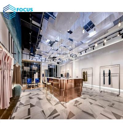 China Ladies Shop Luxury Stainless Steel Clothing Store Display Lady Garment Shop Interior Design Cloth Store Design for sale