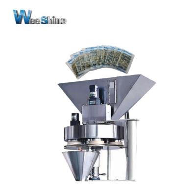 China Food Shanghai Weeshine Cup Volumetric Scale Weighing Filling Equipment For Small Pocket Sunflower Seeds for sale