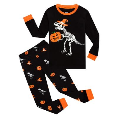 China Halloween Thermal Pajamas Big Boys Girls Glow In The Dark Skeleton Long Sleeve Dinosaur Kids Pajamas for sale