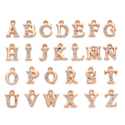 China 2021 New Wholesale Nail Art Bling Gold Apphabet Letter Metal Nail Charms Dangle for sale