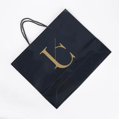 China Factory Logo Recyclable Wholesale Shopping Mall Bags Black Custom Shopping Paper Bag Retail Packaging Bag for sale