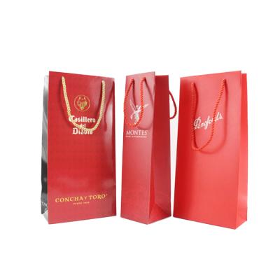 China Recyclable Custom Design Logo Printed Kraft Paper Wine Packaging Bag With Rope Handle for sale