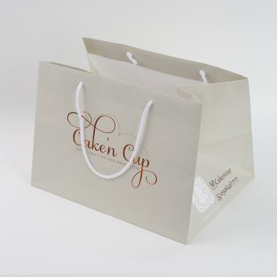 China Luxury Shopping Paper Bags Clothing Packaging Bags Handmade High Quality White Cardboard Bag With Logos for sale