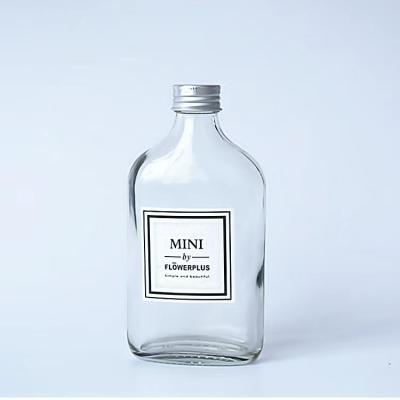 China Flat Square Beverage 100ml Liquor Glass Spirit Bottle With Screw Cap for sale